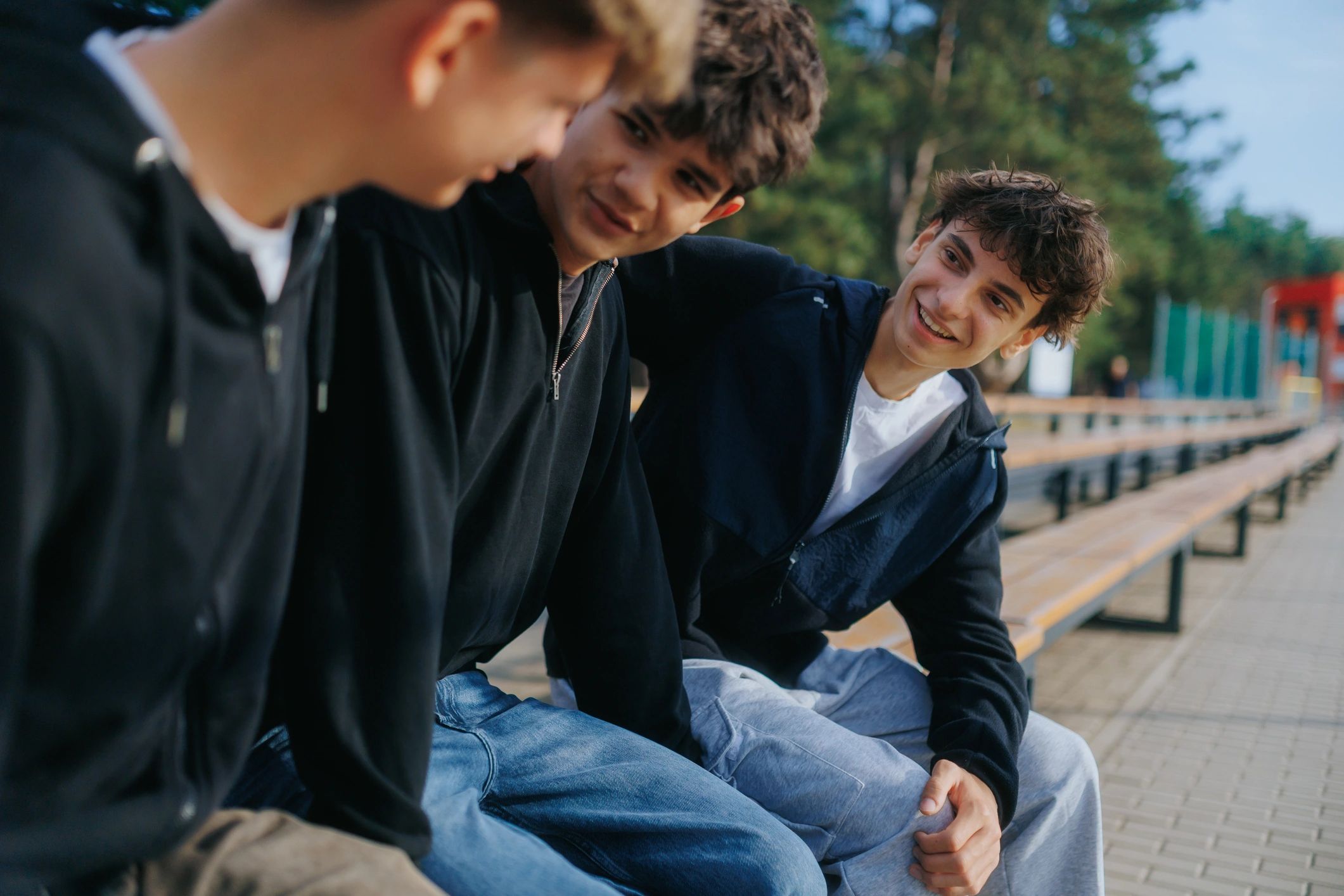 Teenage friends talking together outdoors