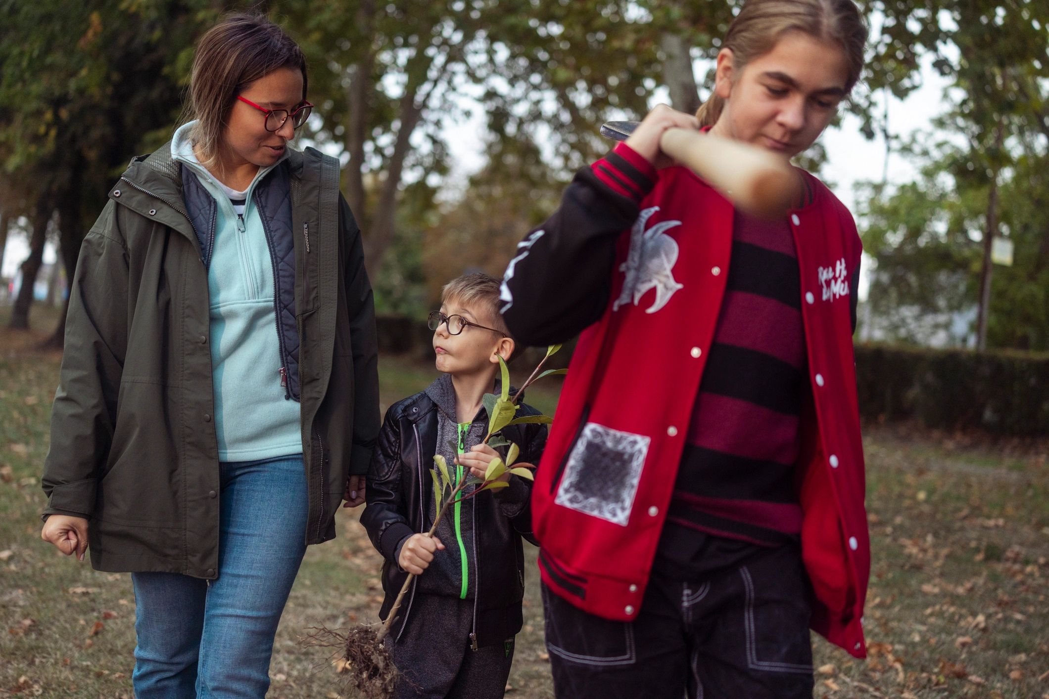 Young people exploring a leafy outdoor space